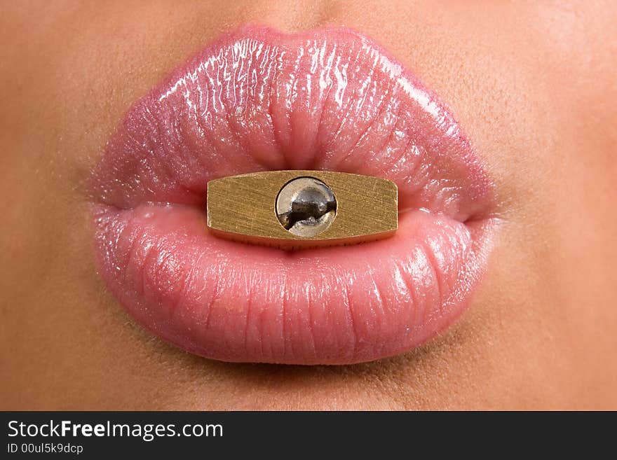 Close-up of woman's lips with padlock. Close-up of woman's lips with padlock