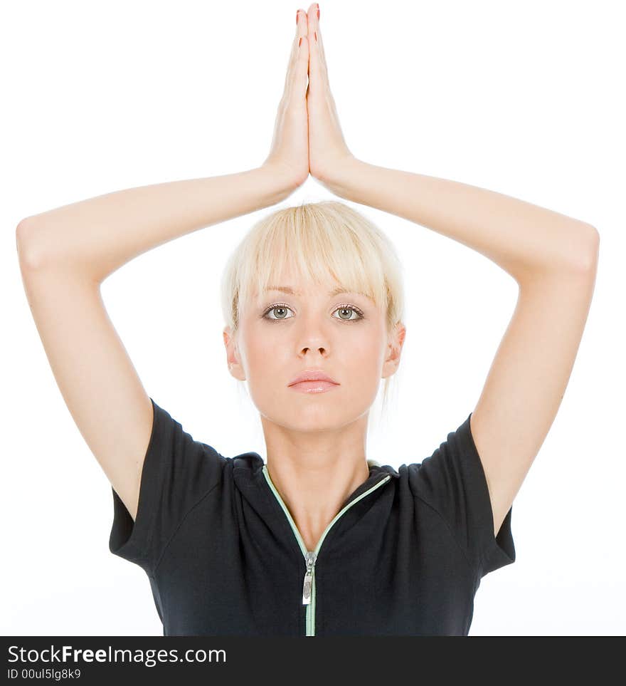 Pretty woman doing yoga exercise