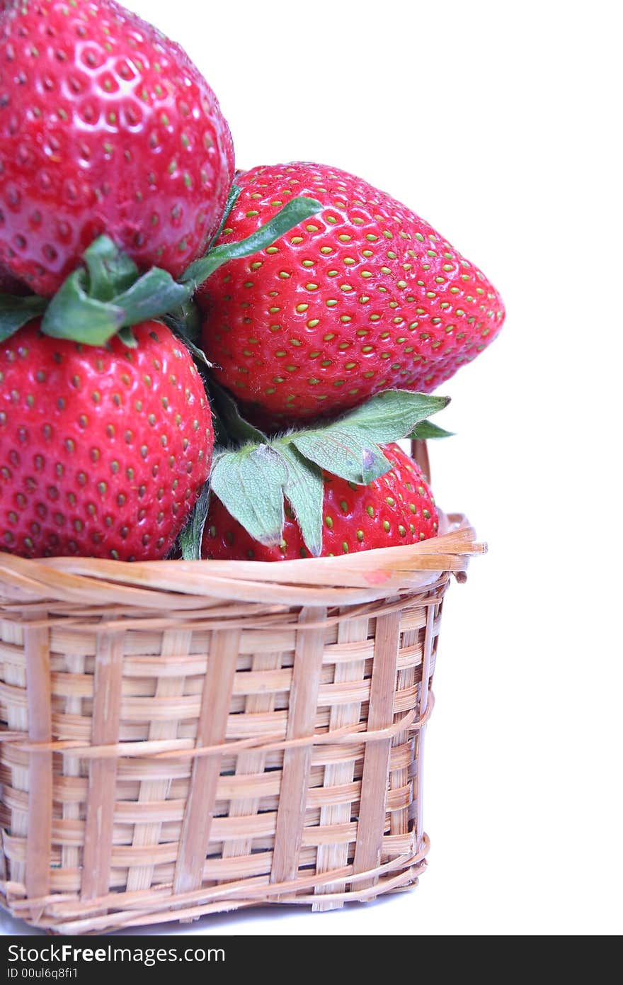 Small basket of strawberries on white