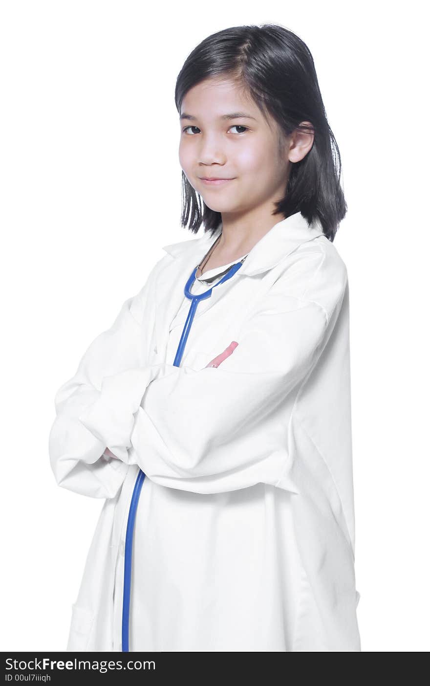 Nine year old girl playing doctor with white lab coat and stethoscope. Nine year old girl playing doctor with white lab coat and stethoscope