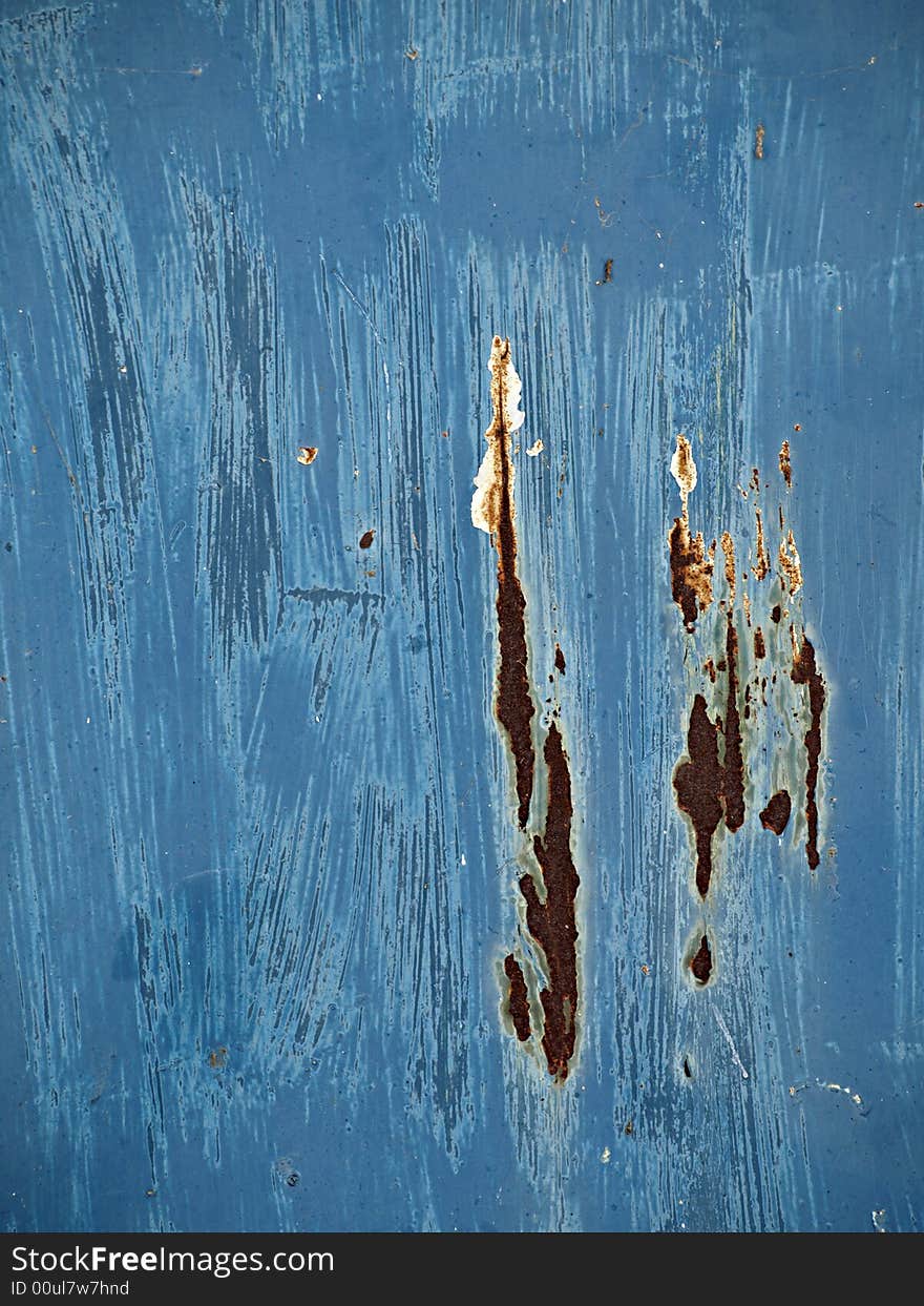 Metal wall, painted blue, old, rusty, and distressed, faded from time and the elements. Metal wall, painted blue, old, rusty, and distressed, faded from time and the elements