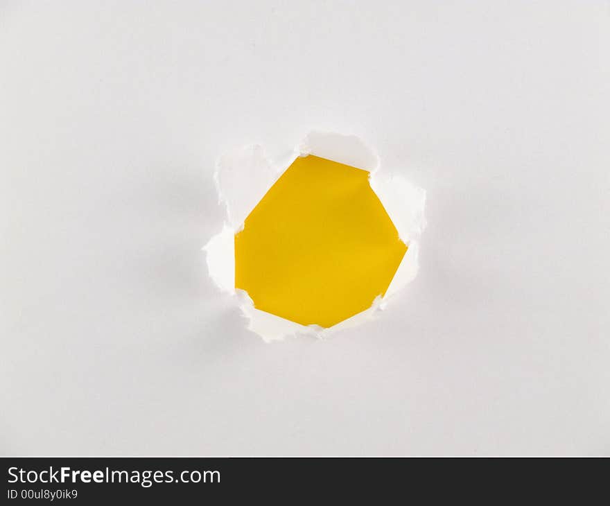 White paper with yellow hole.