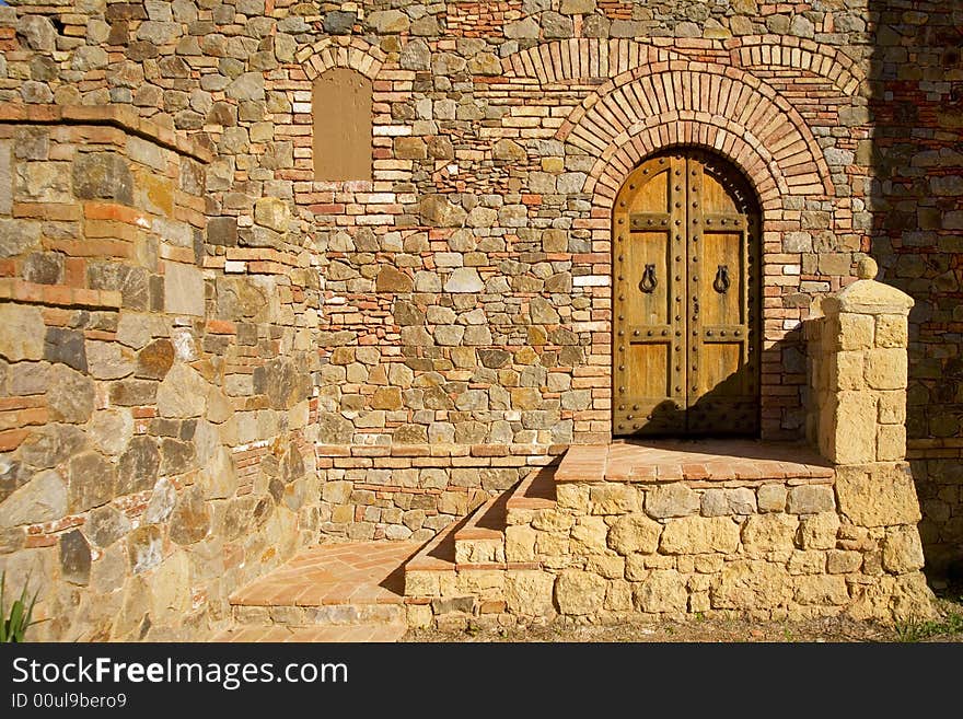 Shot of an oval doorway famed in stone and brick. Shot of an oval doorway famed in stone and brick.