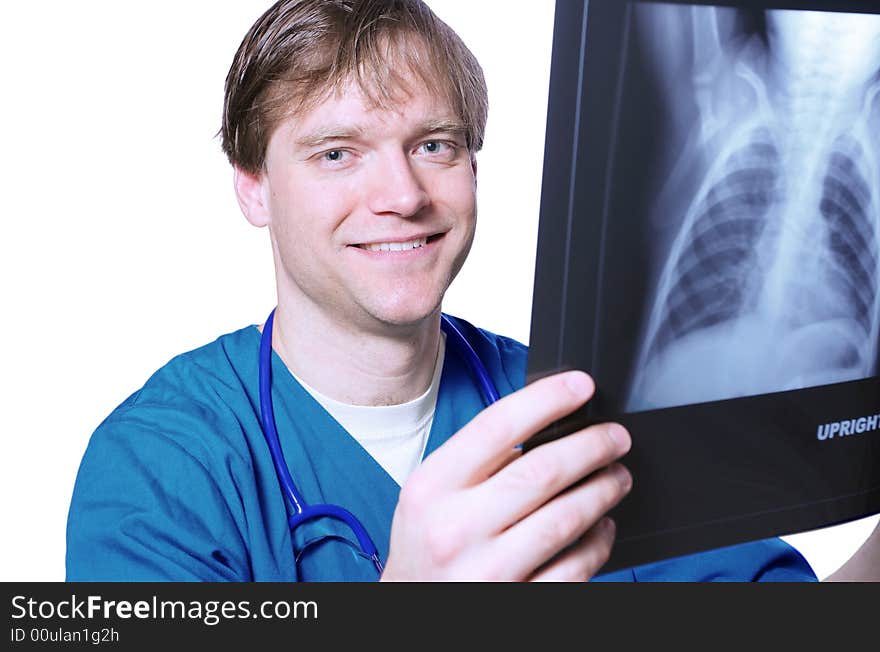 Handsome Male doctor looking at xray