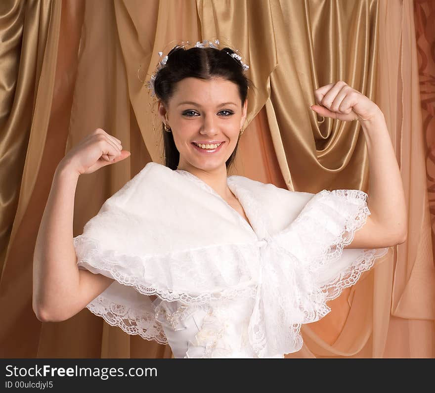 The girl in a wedding dress on beautiful background