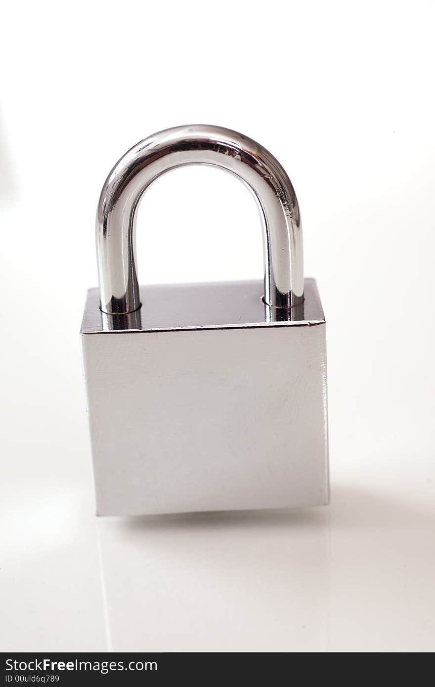 Metal padlock over white