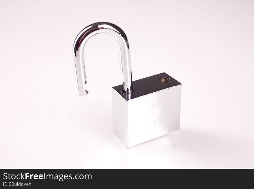 Metal padlock over white background