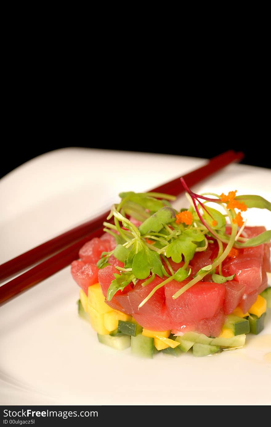 Asian seafood and mango appetizer with micro green salad. Asian seafood and mango appetizer with micro green salad