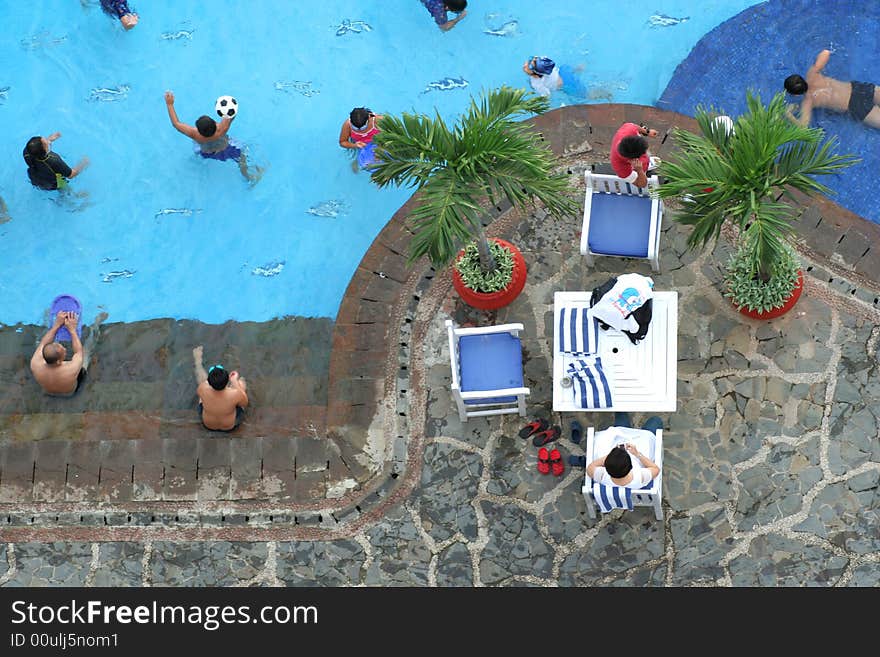 Photograph of pool with peoples in it. Photograph of pool with peoples in it