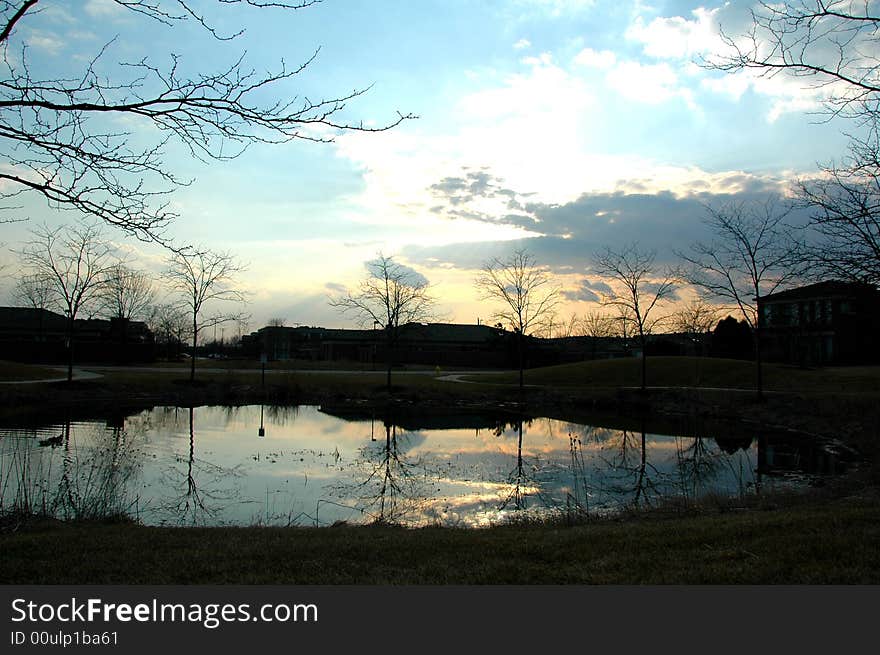 A beautiful sunset casting reflections from the pond