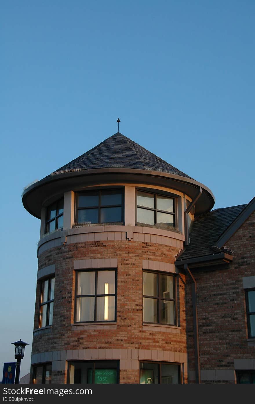 A cottage style tower made of red bricks