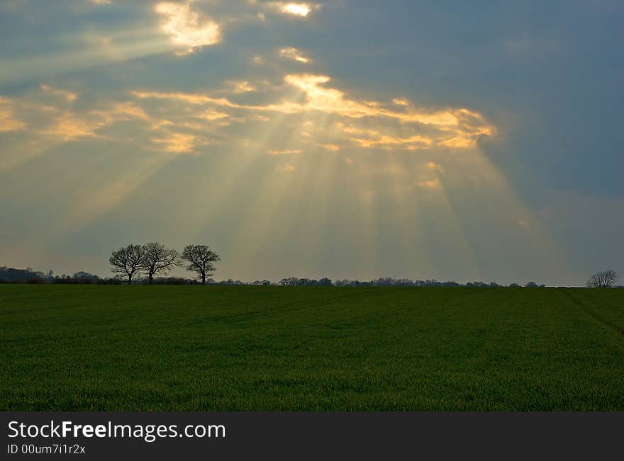 A fantastic sun burst lights a rural scene. A fantastic sun burst lights a rural scene