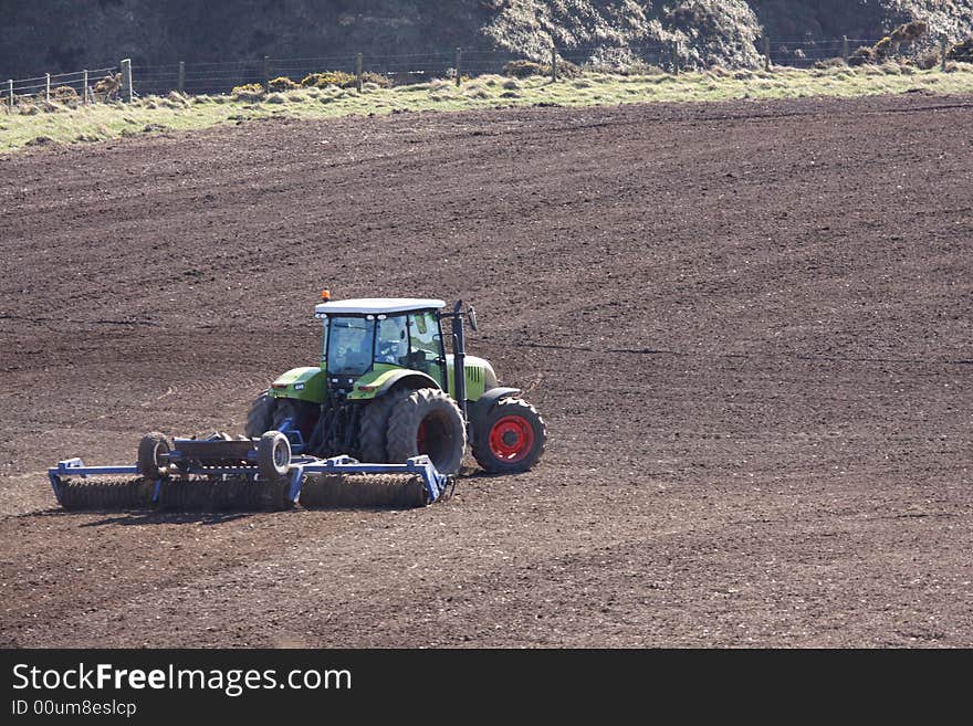 Ploughing the field with Green Tractor, Scotland