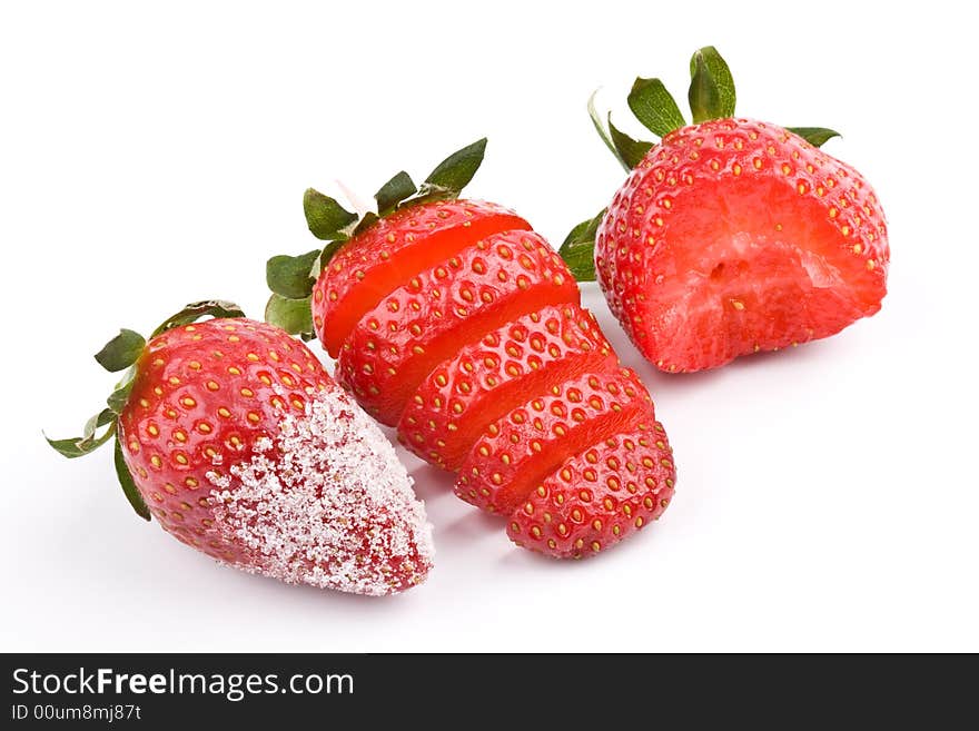 Three Strawberry - sliced, bitten and with sugar