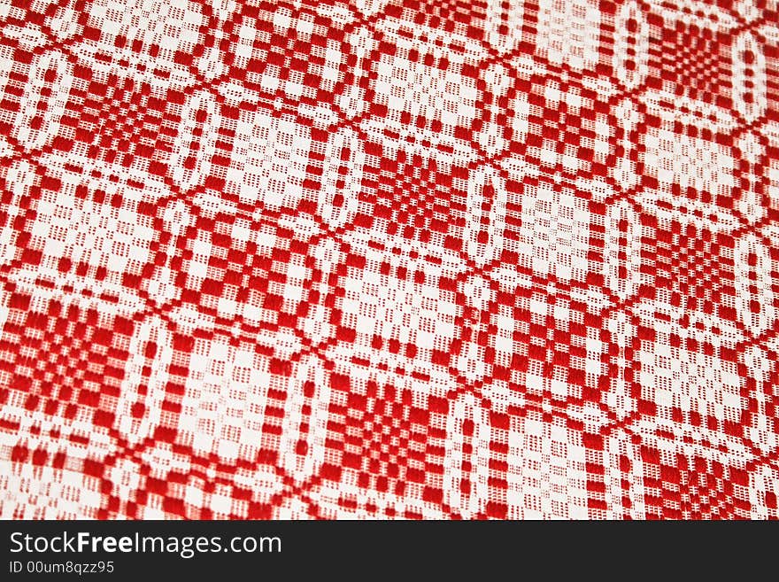 Patterned tablecloth in red and white colors. Patterned tablecloth in red and white colors