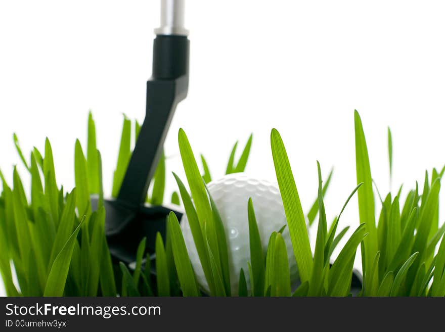 Golf ball on grass isolated