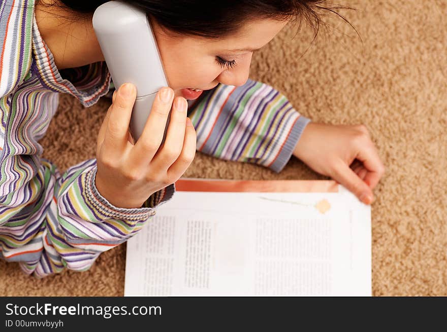 Young woman is speaking on cell phone