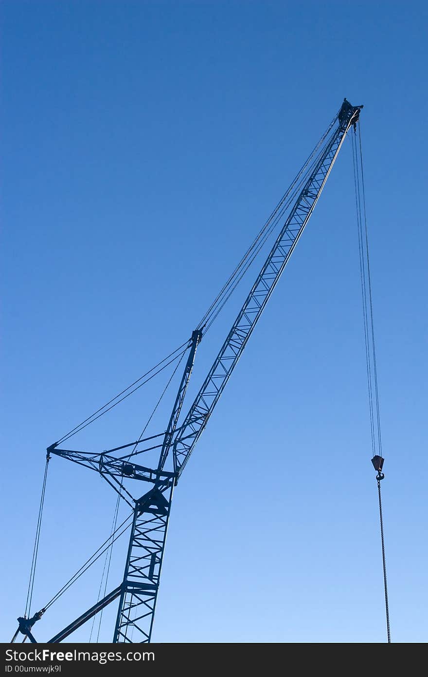 Crane against a deep blue sky