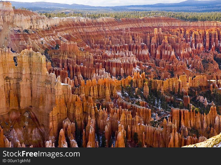 Bryce Canyon National Park is a national park located in southwestern Utah in the United States. this is not actually a canyon, but rather a giant natural amphitheater created by erosion along the eastern side of the Paunsaugunt Plateau. Bryce is distinctive due to its geological structures, called hoodoos, formed from wind, water, and ice erosion of the river and lakebed sedimentary rocks. The red, orange and white colors of the rocks provide spectacular views to visitors.