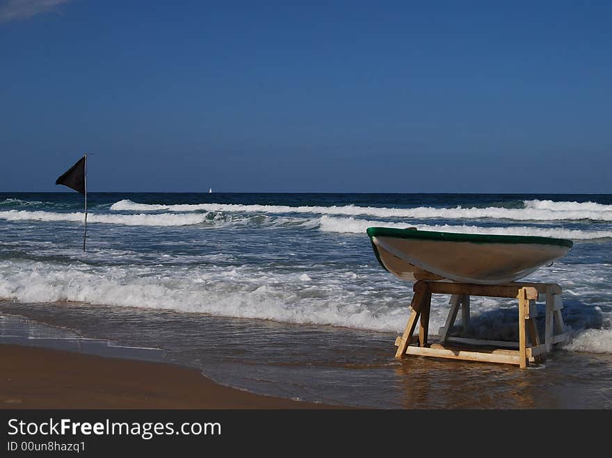 Plastik boat ashore line of sea on wooden shelf