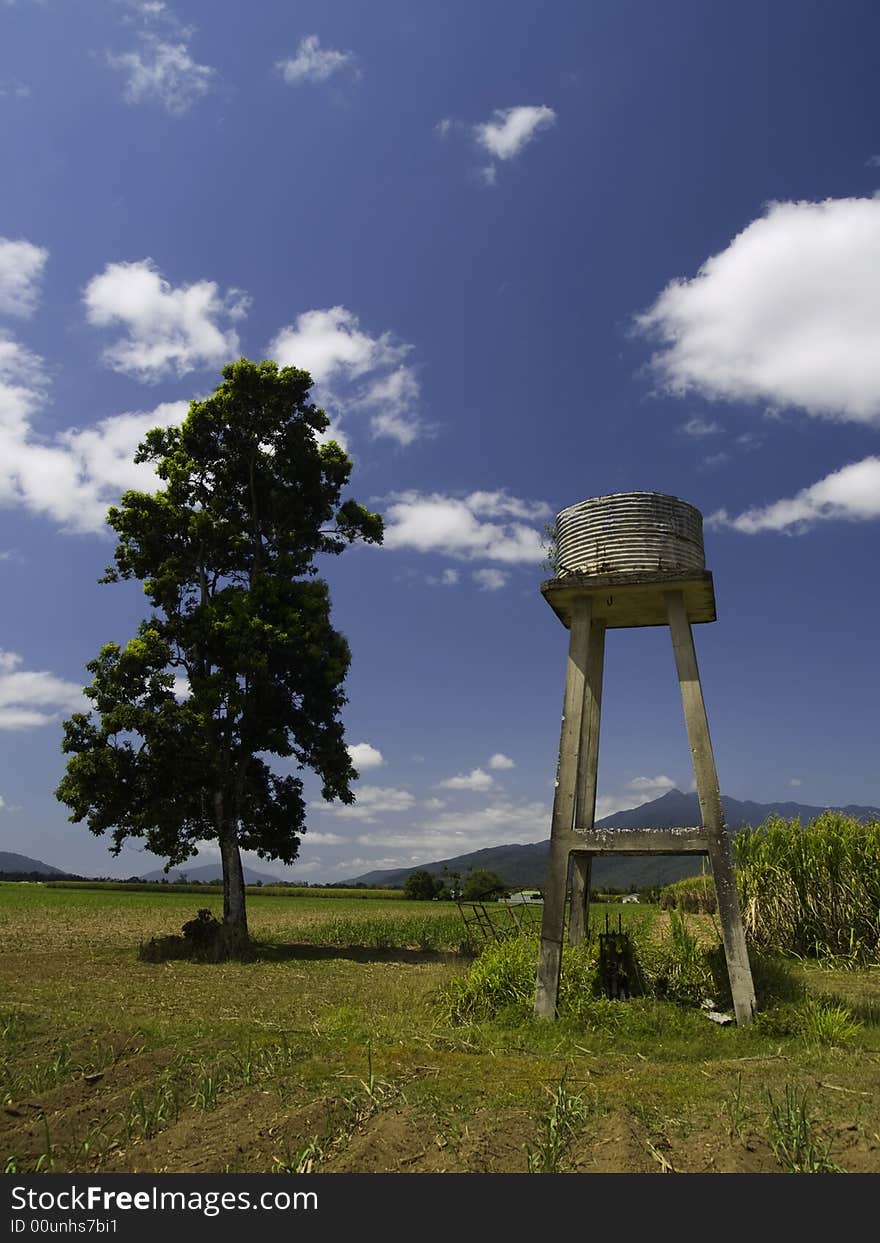 A small water tower on a sugar cane plantation in Australia. A small water tower on a sugar cane plantation in Australia.