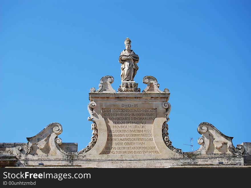 Top of a city door with inscription in Latin