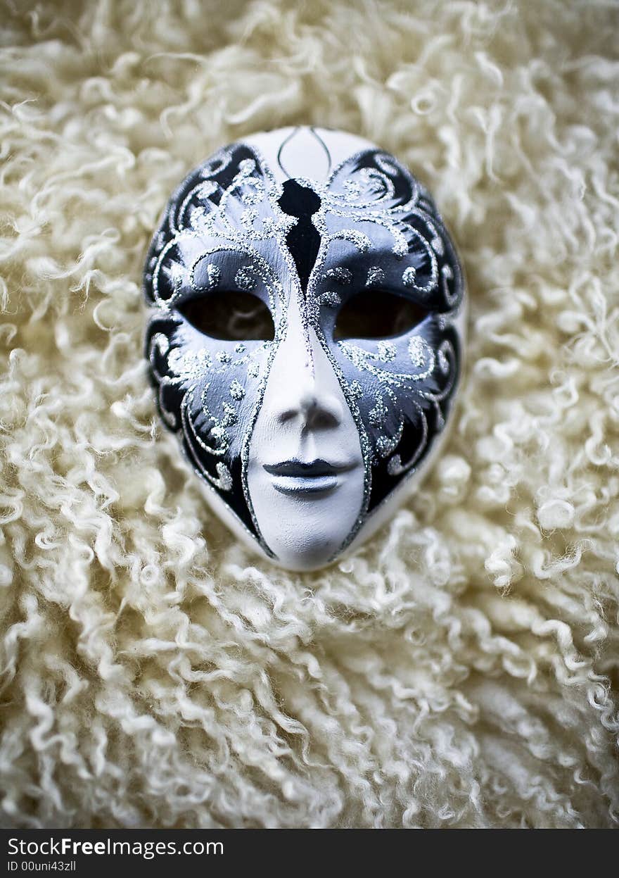 Mask on the a piece of sheep's wool