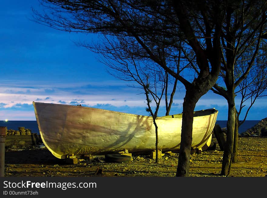 Shot of boat in Marina, Semarang, Indonesia. Taken a few minutes after sunset, got the lighting from incandescent lamp 10m away from the boat. Shot of boat in Marina, Semarang, Indonesia. Taken a few minutes after sunset, got the lighting from incandescent lamp 10m away from the boat.