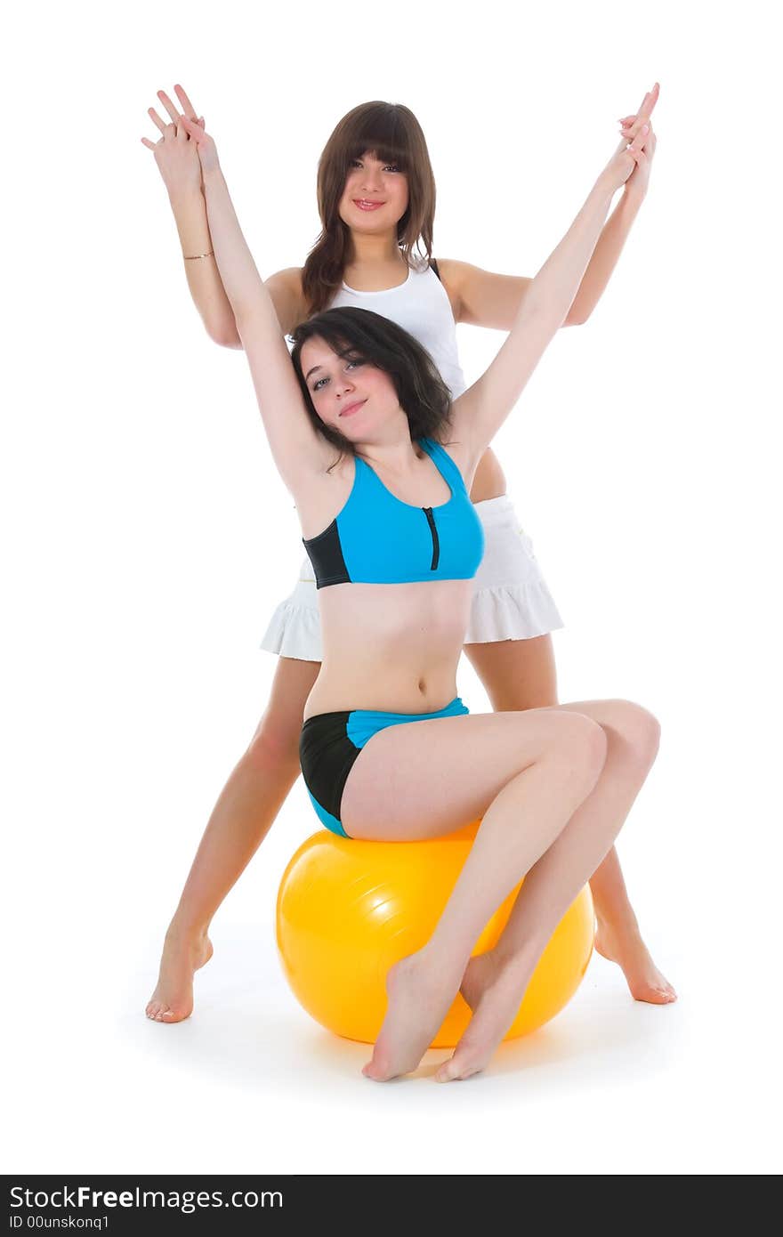 Girls practicing fitness  on  white  background