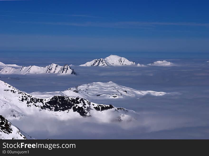 Mountain peaks above the clouds