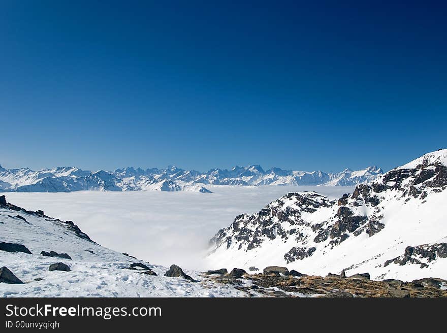 Mountain peaks above the clouds. Mountain peaks above the clouds