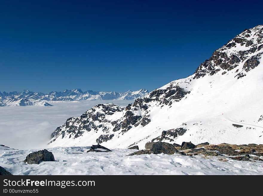 Mountain peaks above the clouds. Mountain peaks above the clouds