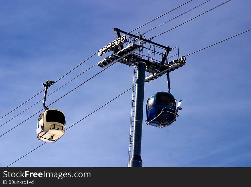 Two ski lift cabins passing