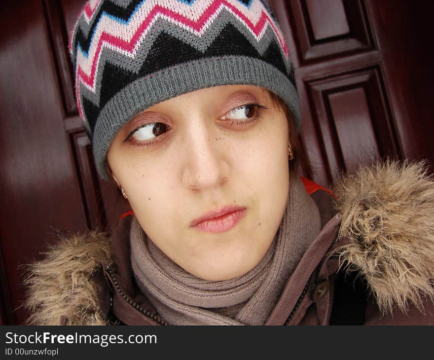 Closeup portrait of a girl in cap outdoors winter. Closeup portrait of a girl in cap outdoors winter