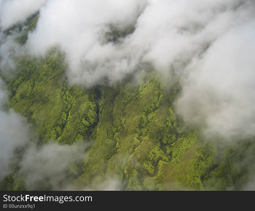 Lush green valley and clouds on the Big Island of Hawaii taken from a helicopter. Lush green valley and clouds on the Big Island of Hawaii taken from a helicopter