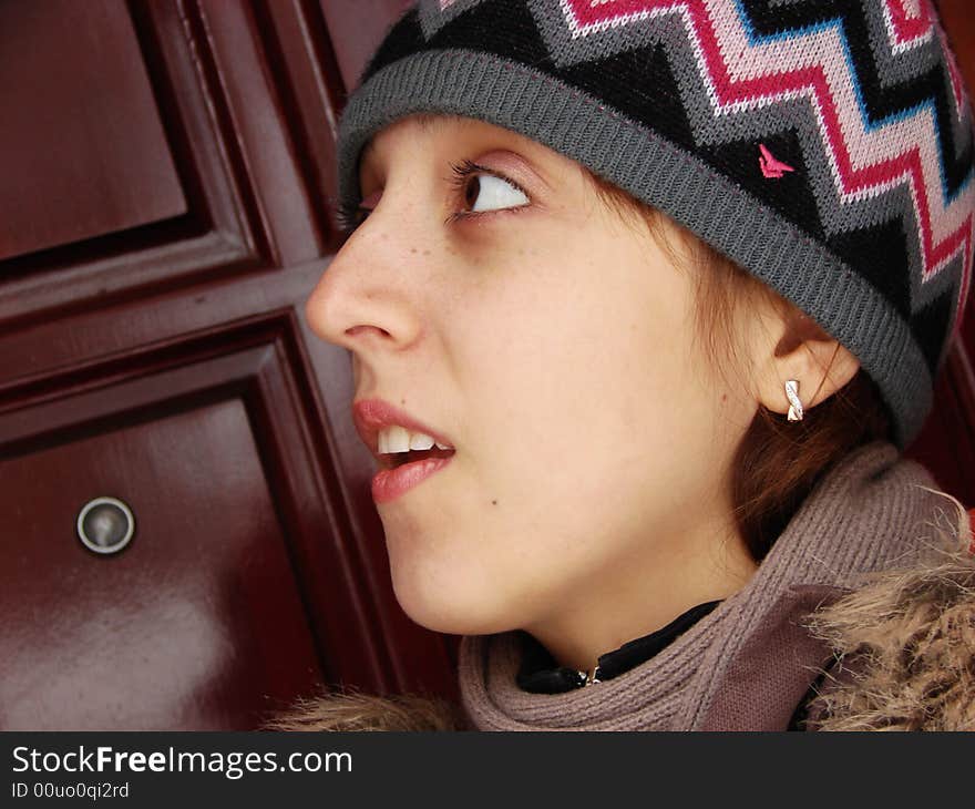 Closeup portrait of a girl in cap outdoors winter. Closeup portrait of a girl in cap outdoors winter