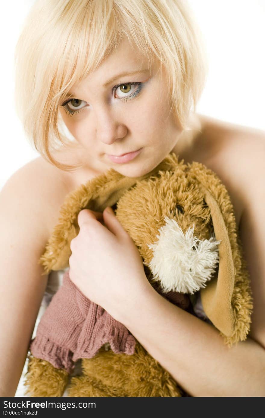 Girl with hand-made toy on the white-background, Focus on the eye.