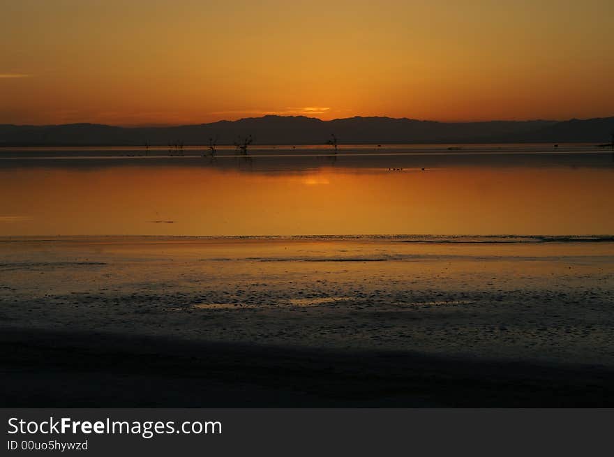 Golden sunset at Salton sea lake