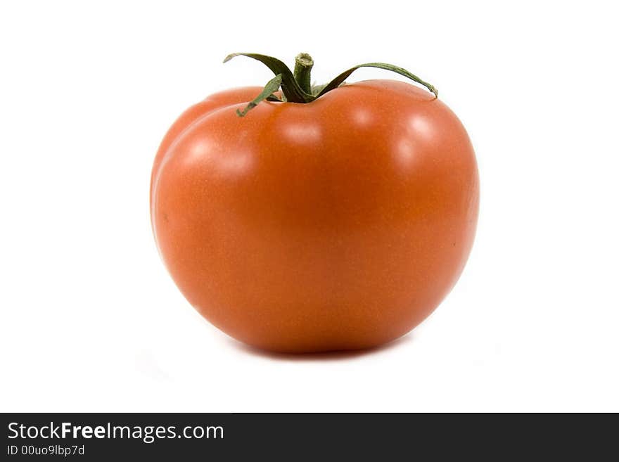 Red shiny single tomato isolated on white