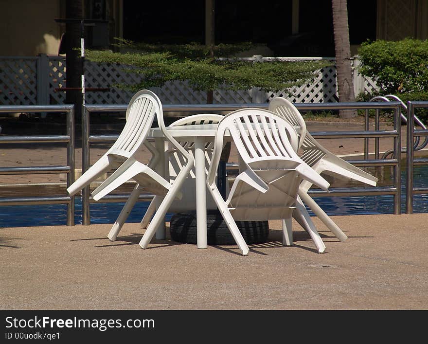 Table and chairs by the pool