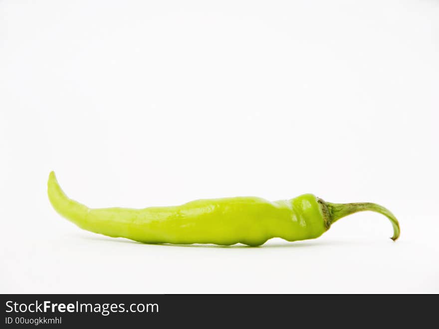 Chili green pepper on white background, shallow DOF