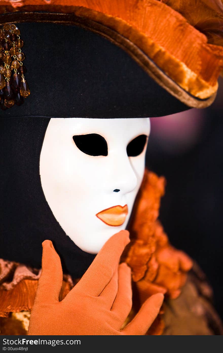 Black and orange costume at the Venice Carnival. Black and orange costume at the Venice Carnival