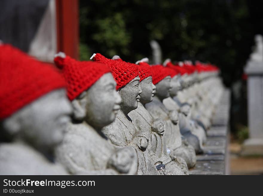 Statuary with red hat