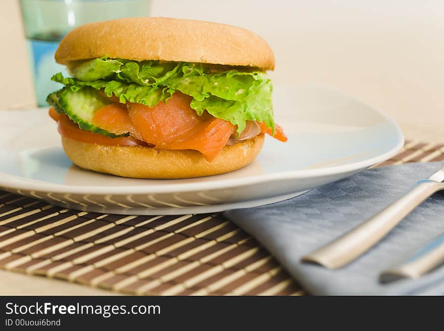 Bakel filled with lettuce and cold smoked salmon. Bakel filled with lettuce and cold smoked salmon