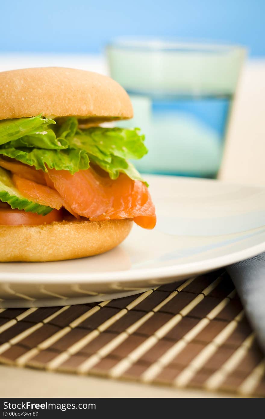 Cold smoked salmon bagel on the table. Cold smoked salmon bagel on the table