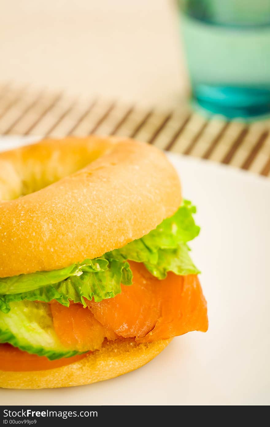 Cold smoked salmon bagel on the table. Cold smoked salmon bagel on the table