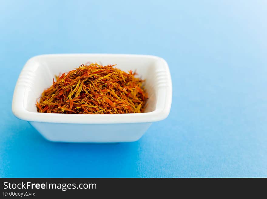 Vase of Saffron over a blue background