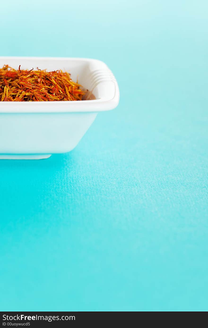 Vase of Saffron over a light blue background