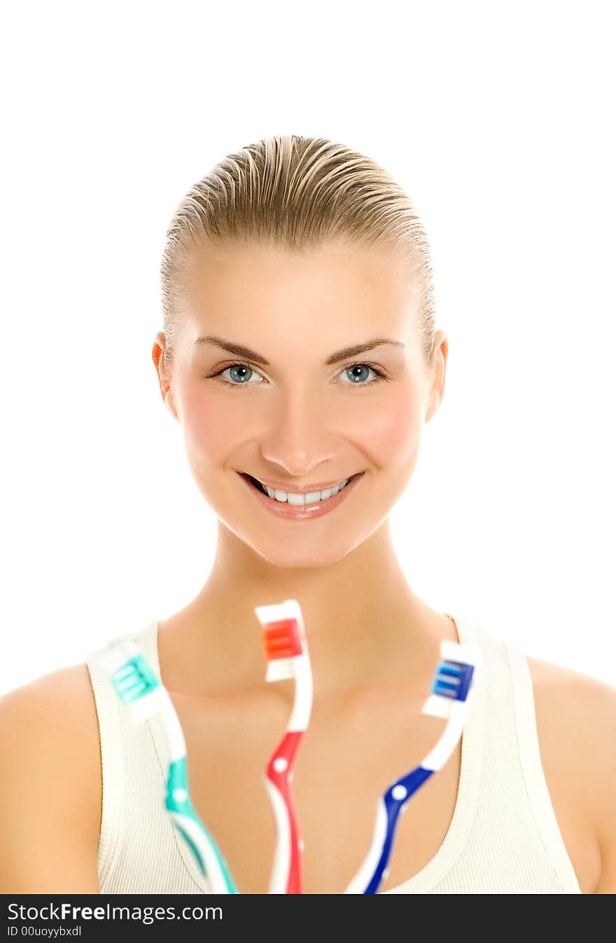 Beautiful young woman with three different types of toothbrushes. Beautiful young woman with three different types of toothbrushes