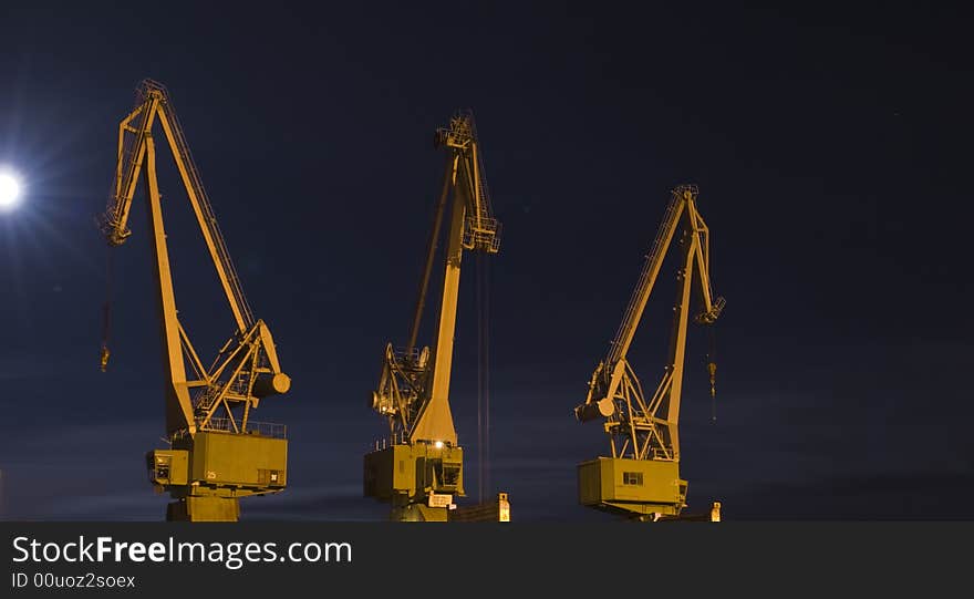 Two old cranes and moonlight